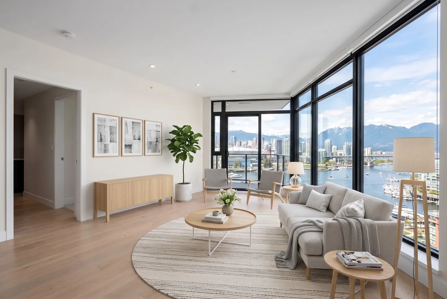 The living room staged in the scandinavian style: Scandinavian, light wood, white and soft grey, bright and airy.